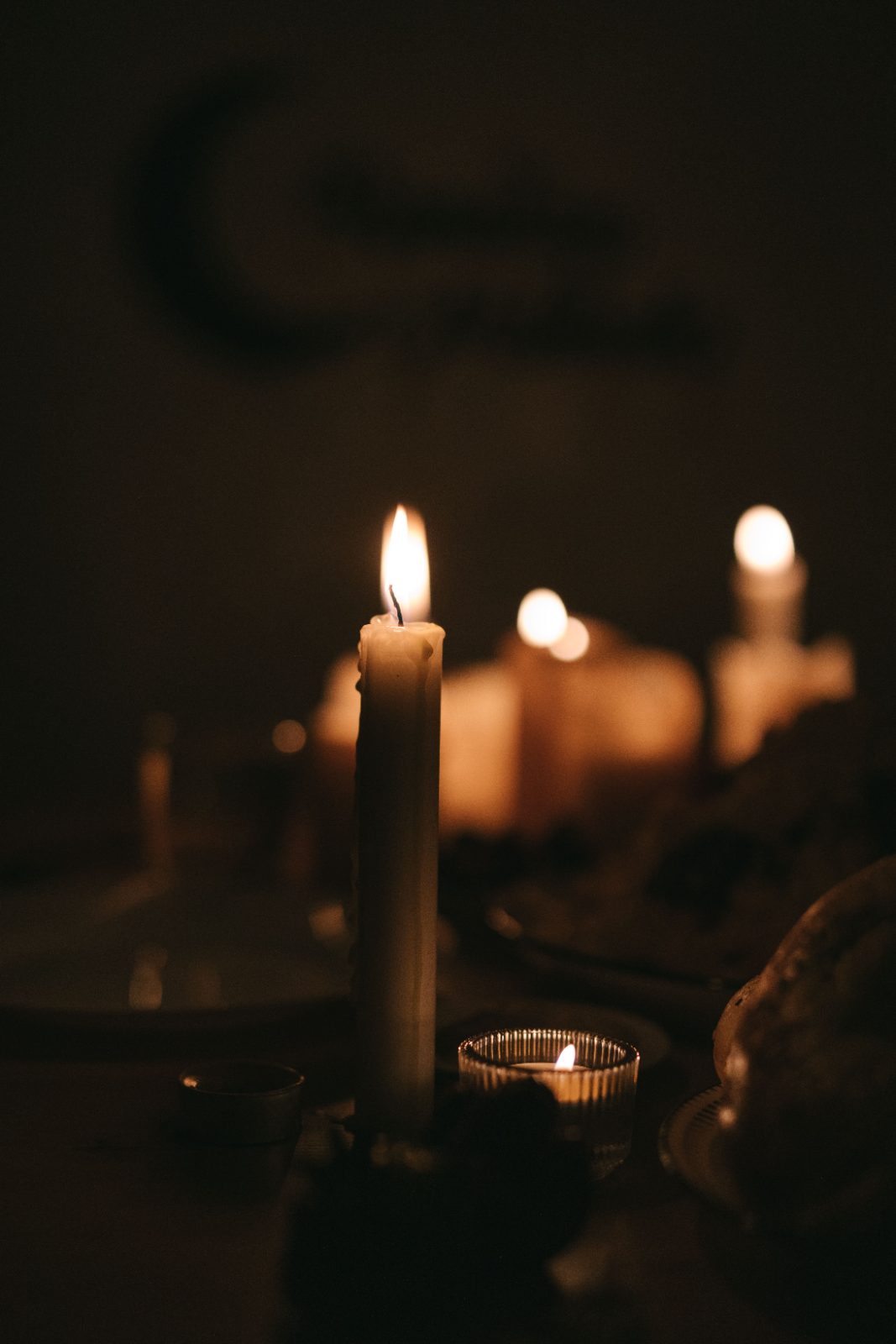 Candles burning in a dark room