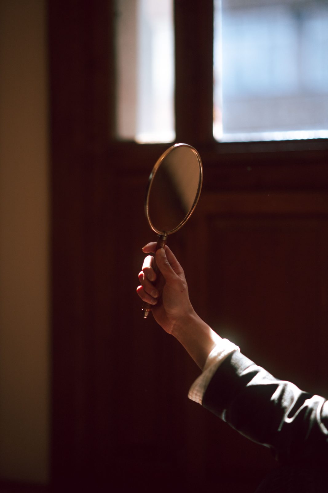 A hand mirror on a table